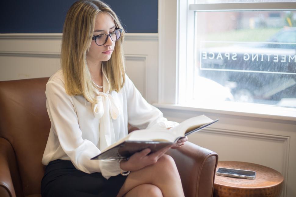 Professional woman reviewing financial documents